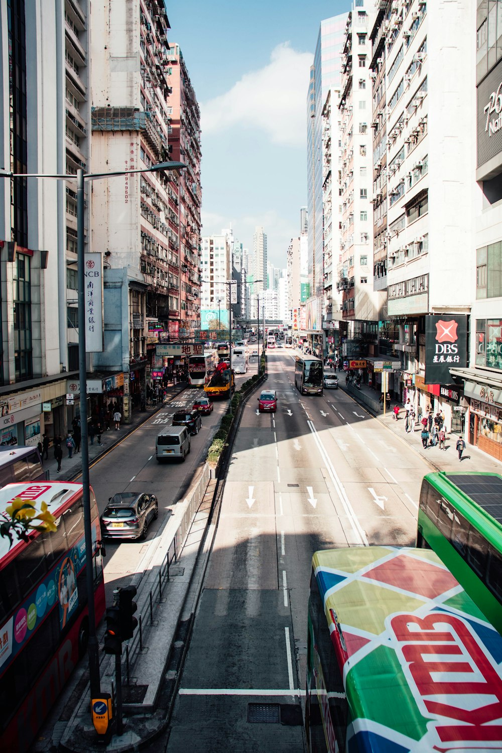 a city street filled with traffic and tall buildings