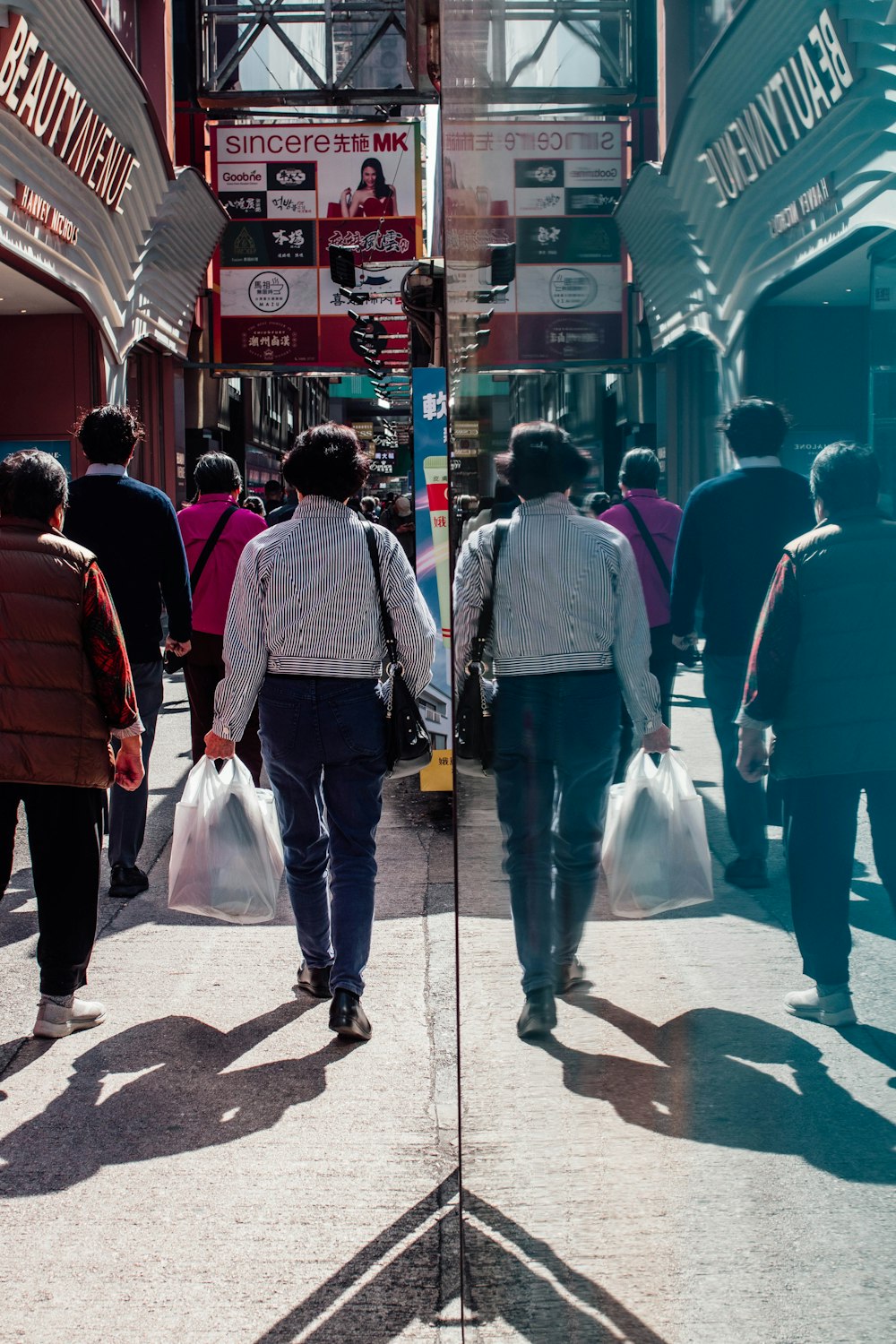 a group of people walking down a street