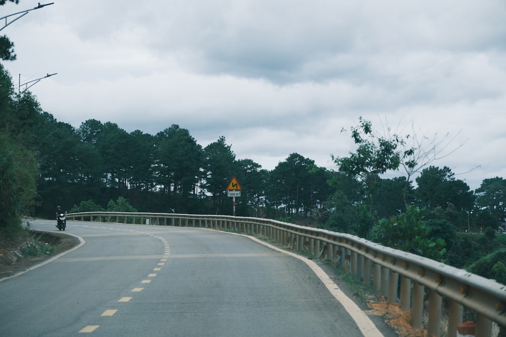 a road with a sign on the side of it