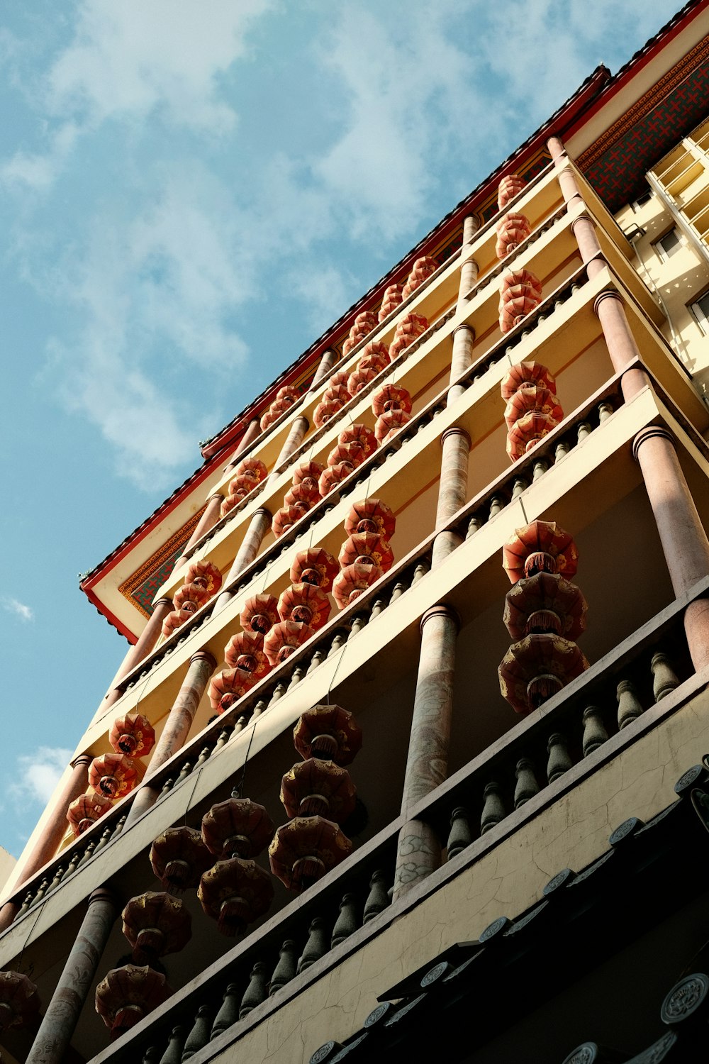 a tall building with donuts hanging off of it's sides