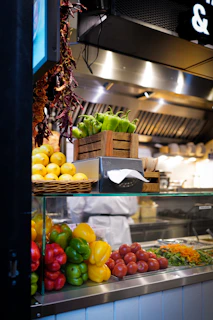 a kitchen filled with lots of different types of vegetables