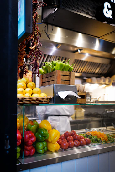 a kitchen filled with lots of different types of vegetables