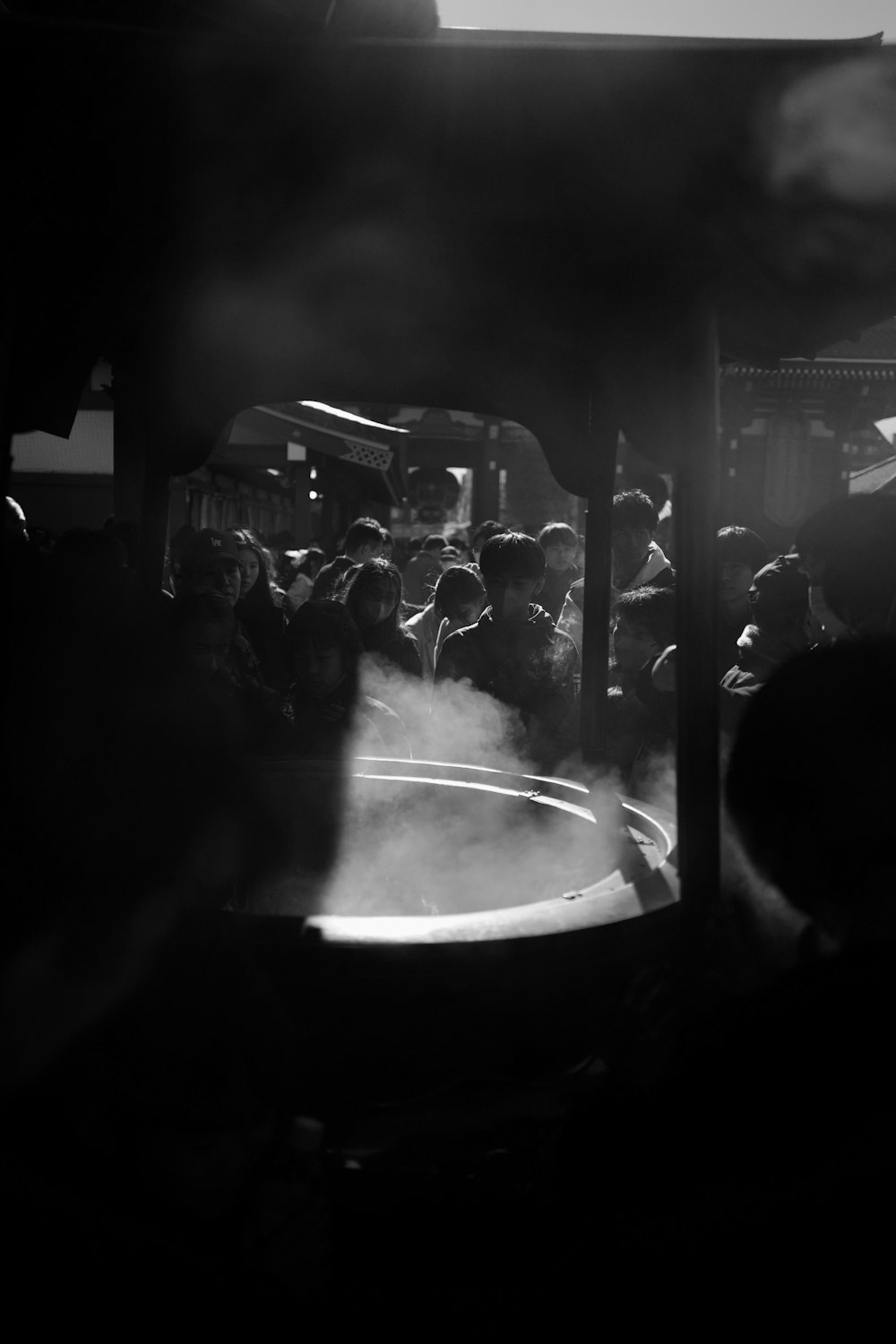 a black and white photo of a crowd of people