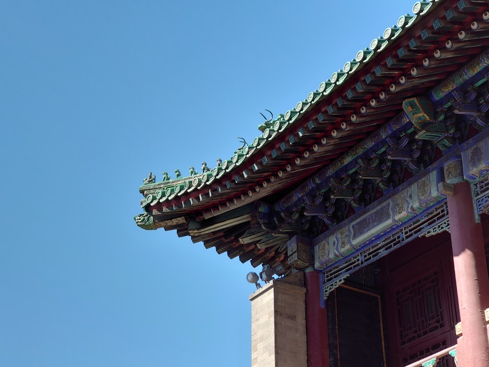 a tall building with a blue sky in the background