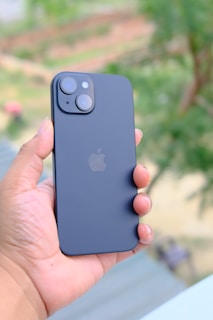 a person holding an iphone in their hand