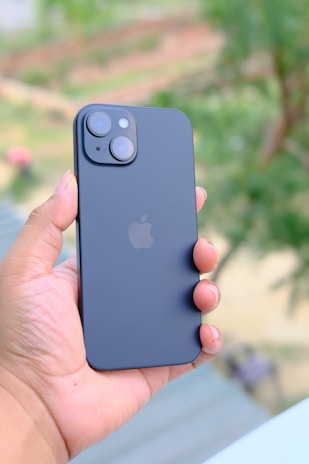 a person holding an iphone in their hand