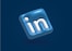a blue and white linked icon on a blue background