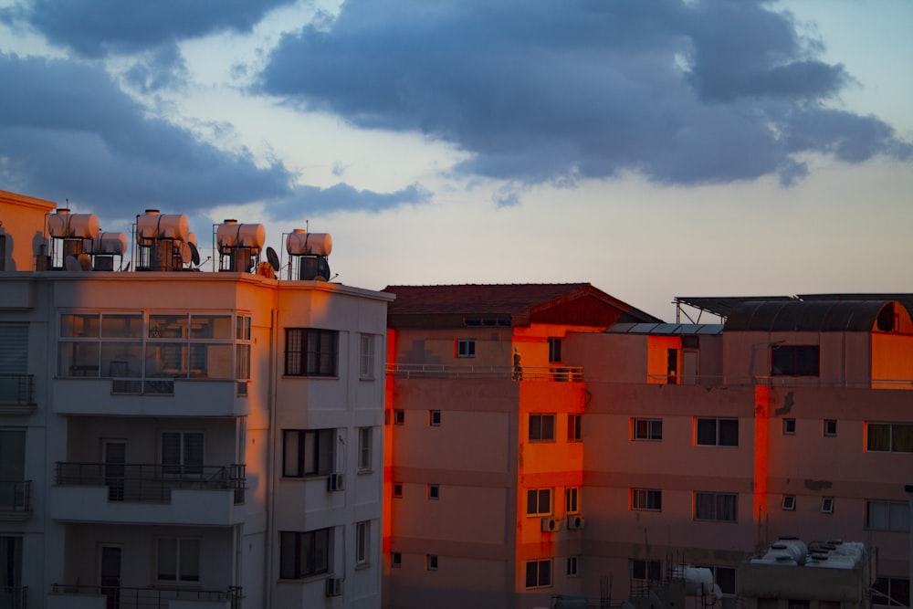 a group of buildings with a sky in the background