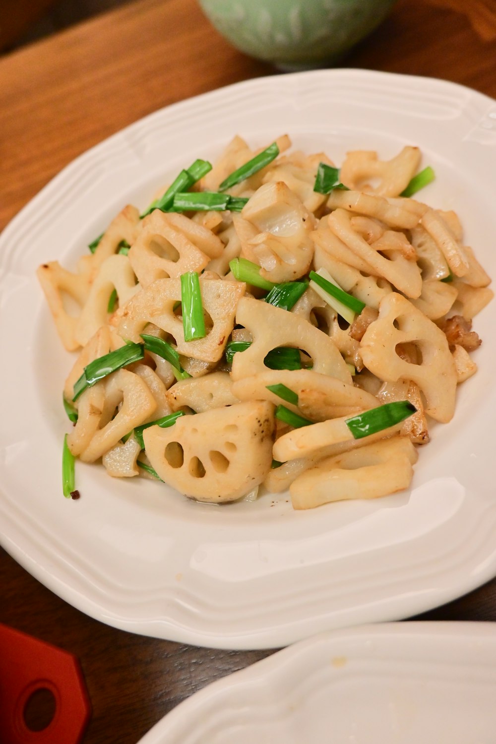 a white plate topped with pasta covered in sauce