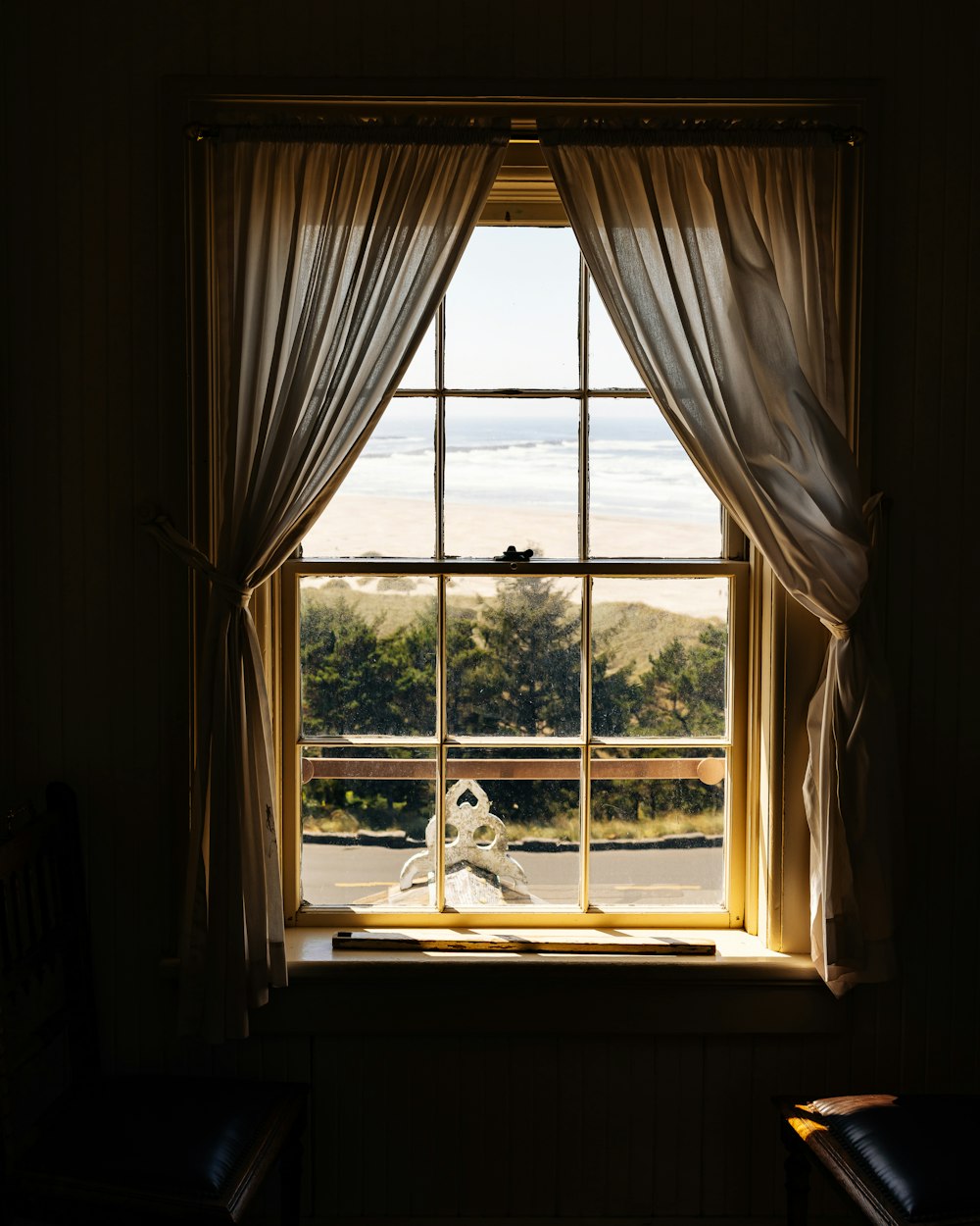 a window with a view of the ocean