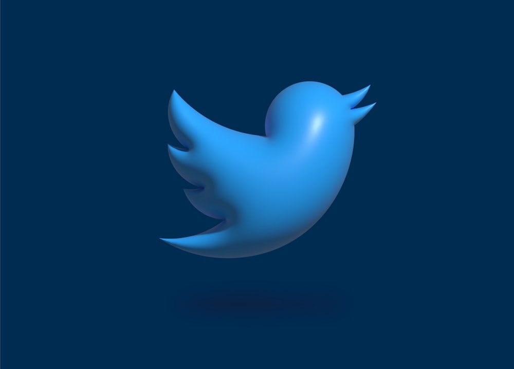 a blue twitter logo on a dark blue background