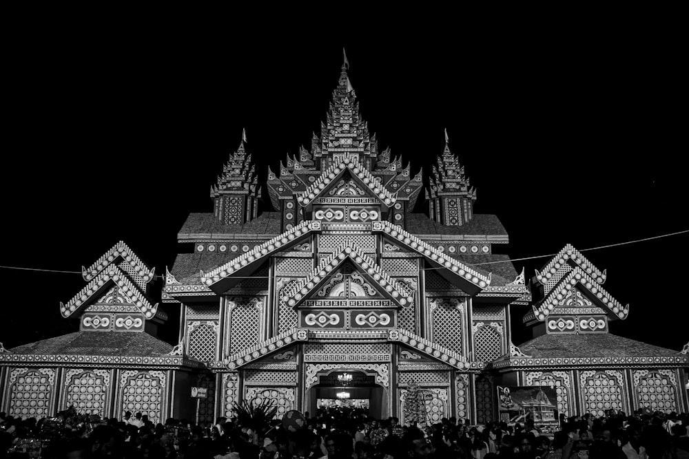 a black and white photo of a building at night