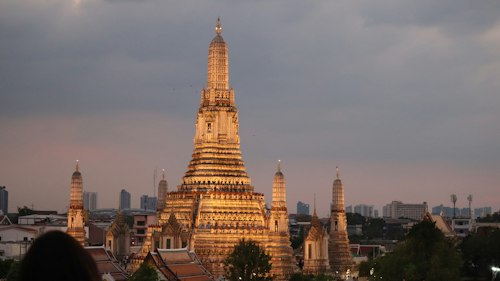 Wat Arun's spire at golden hour, Bangkok, Thailand