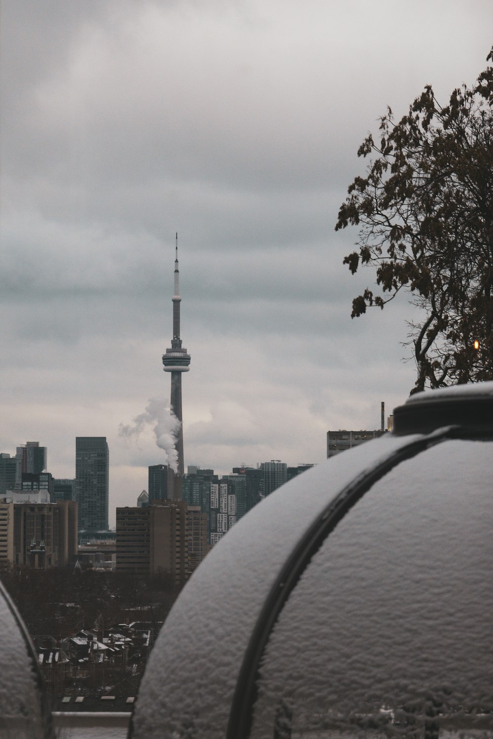 a view of a city with a tower in the background