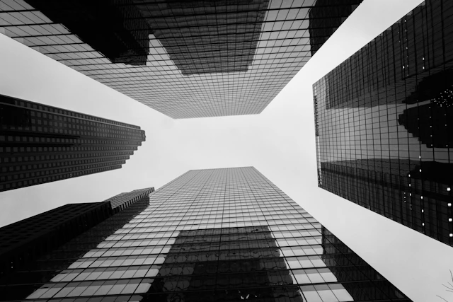 a black and white photo of tall buildings