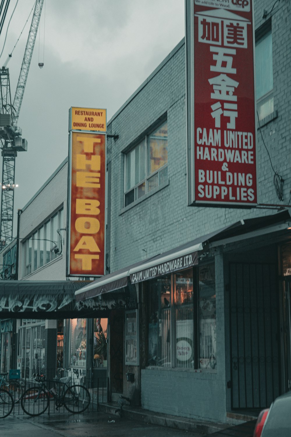 a building with a crane in the background