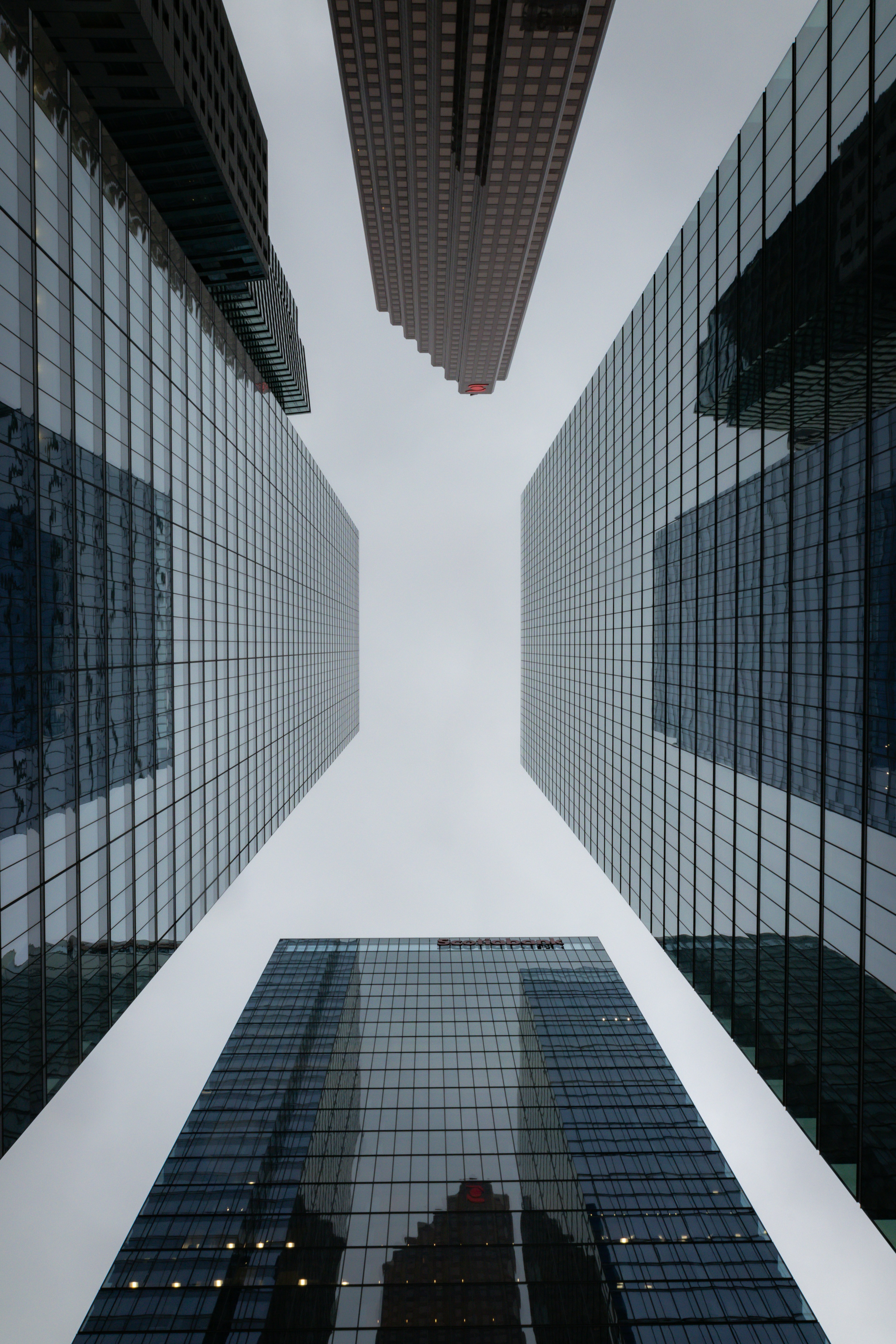 a group of tall buildings with a sky background
