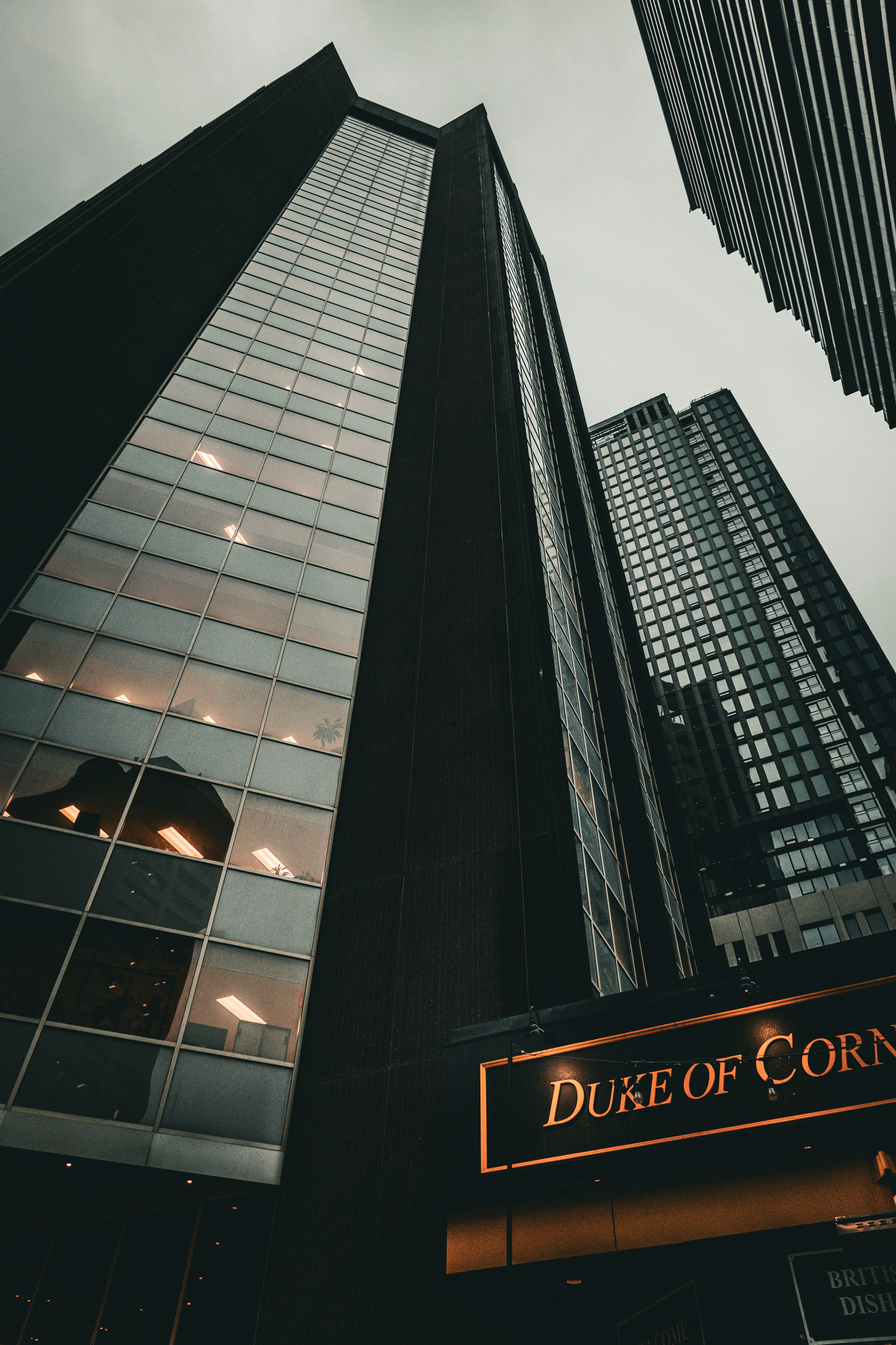 a couple of tall buildings sitting next to each other