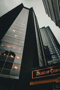 a couple of tall buildings sitting next to each other