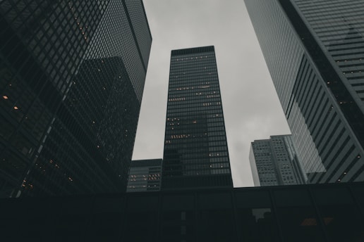 a group of tall buildings towering over a city