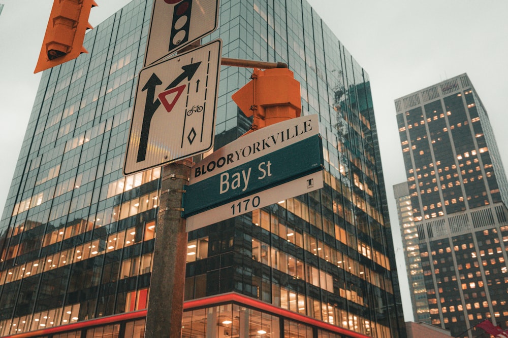 a street sign in front of a tall building