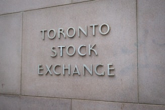 a sign on the side of a building that says toronto stock exchange
