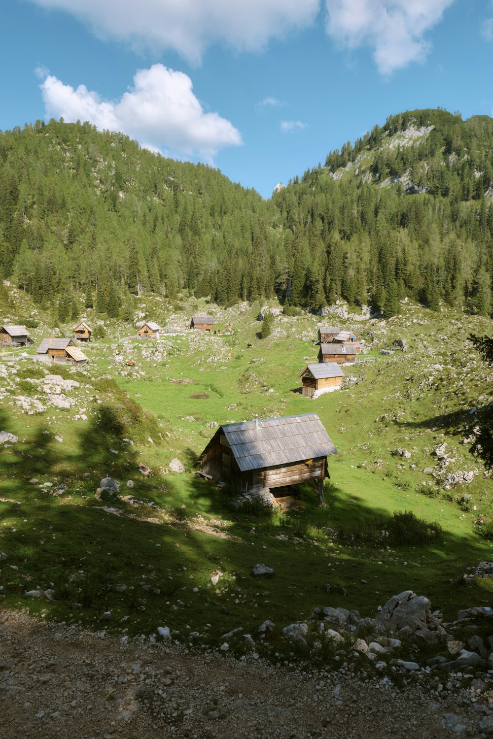 a small cabin in the middle of a field