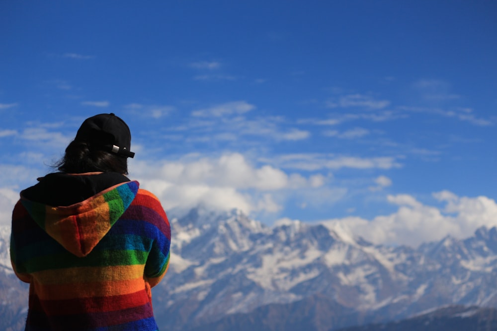 a person standing in front of a mountain range