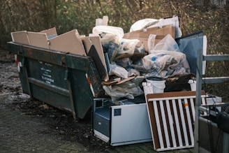 a pile of garbage sitting next to a pile of trash