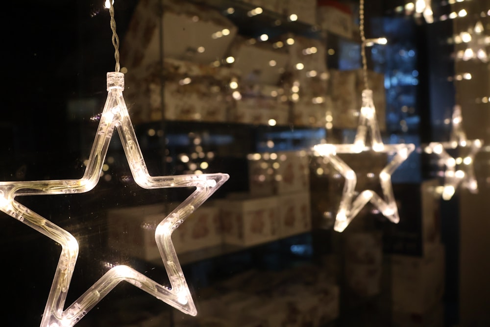 a lighted star hanging from a string of lights