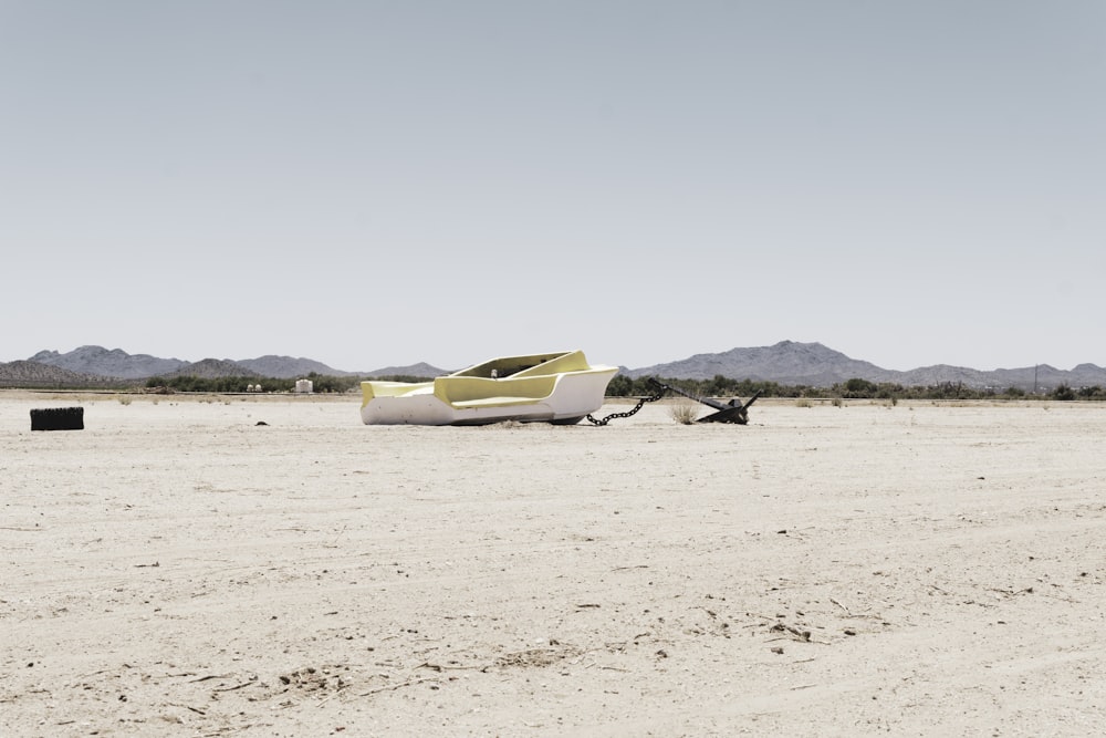 a plane sitting in the middle of a desert