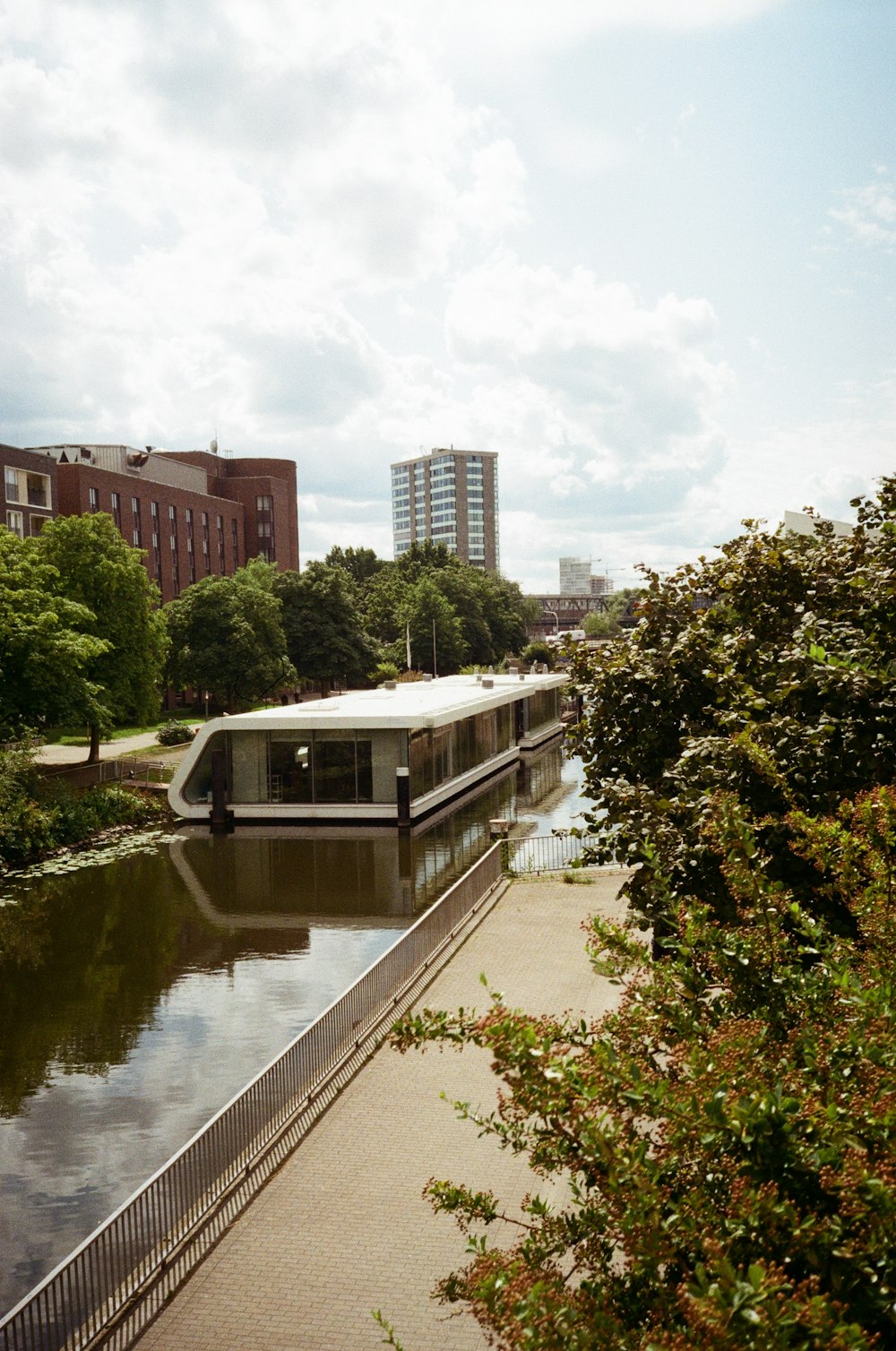 a house boat floating on top of a river