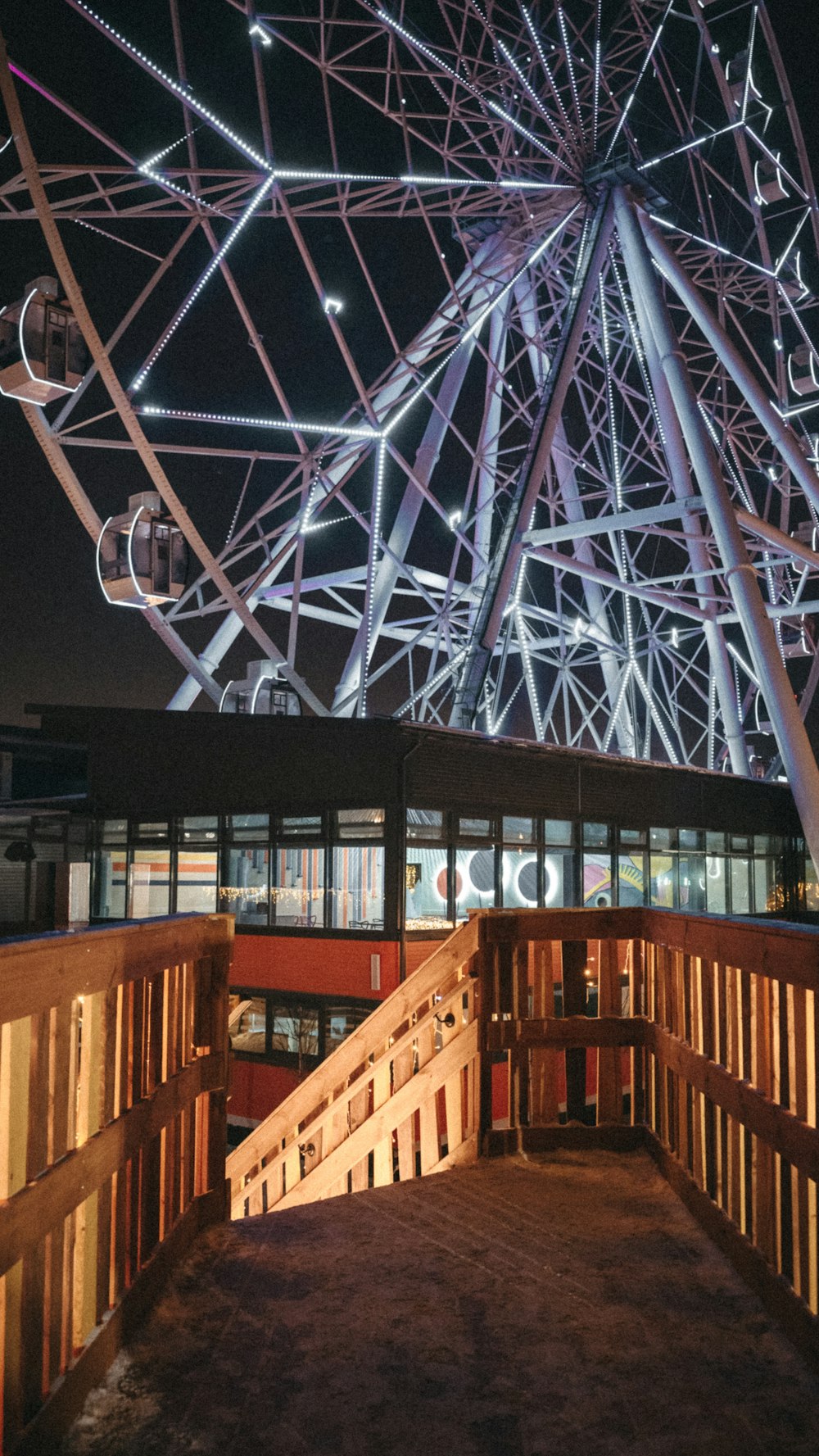 a large ferris wheel lit up at night