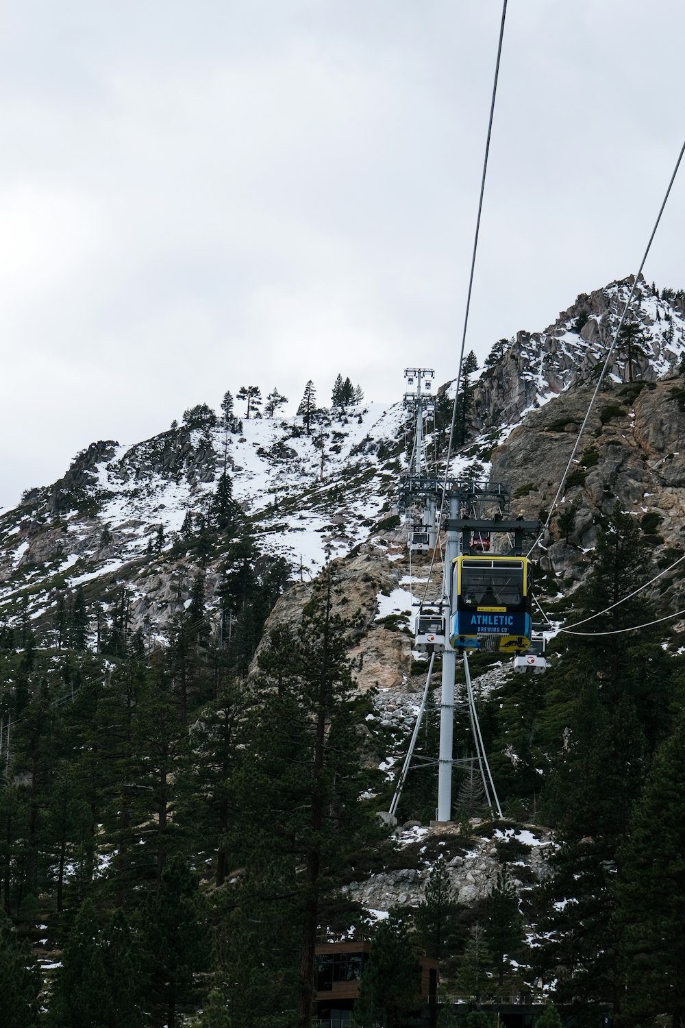 a ski lift going up the side of a mountain