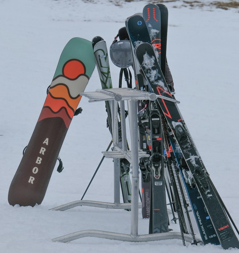 a rack of skis and ski poles in the snow