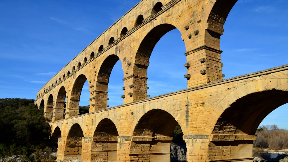 an old stone bridge with arches and arches