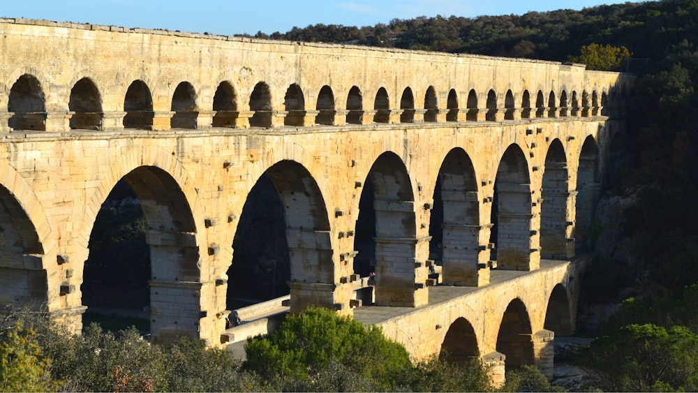 an old stone bridge with arches and arches