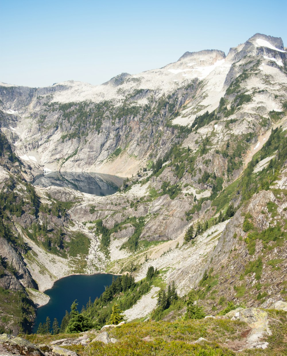 a view of a mountain range with a lake in the middle