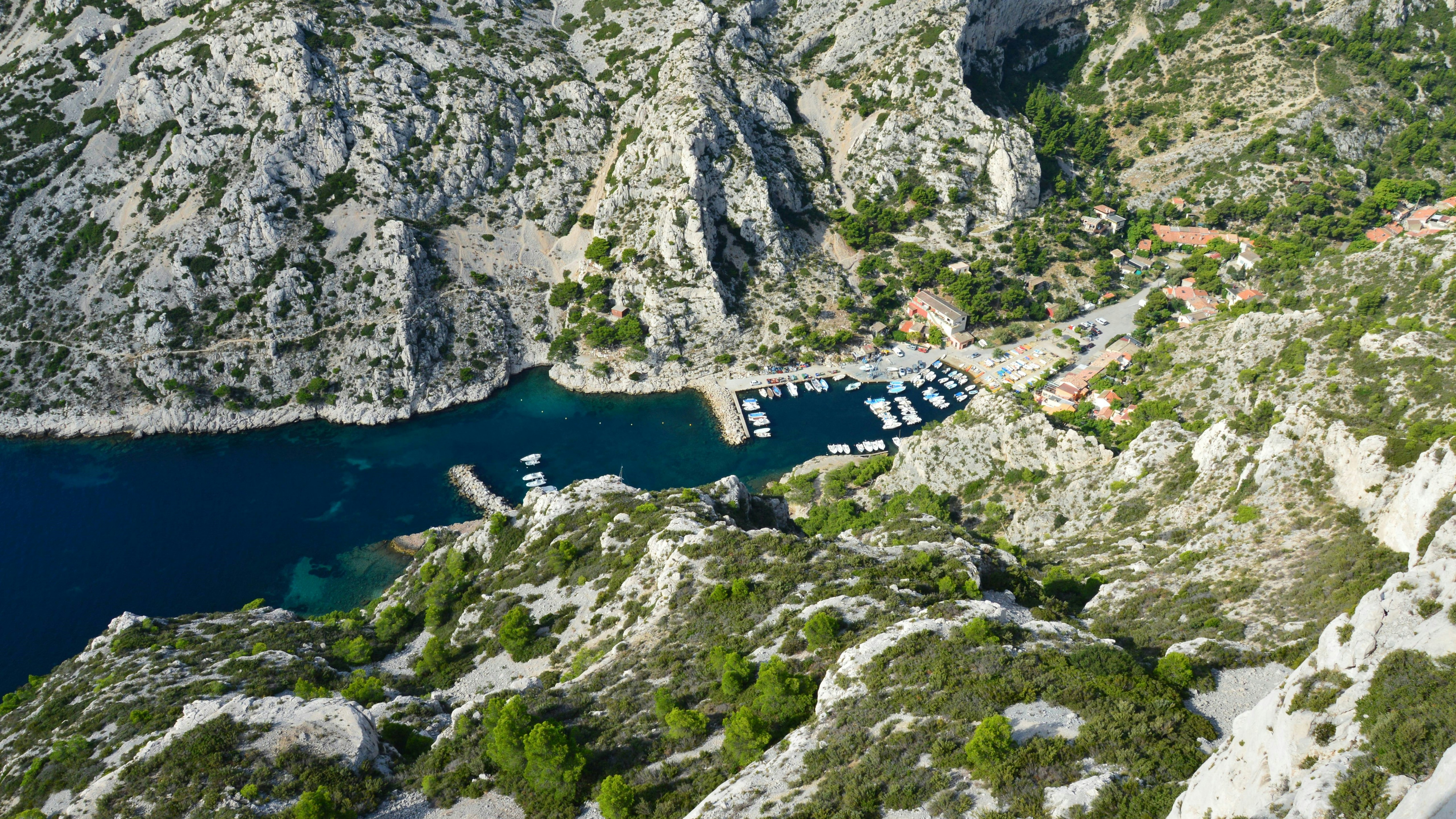 an aerial view of a bay surrounded by mountains