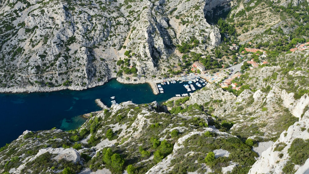 an aerial view of a bay surrounded by mountains