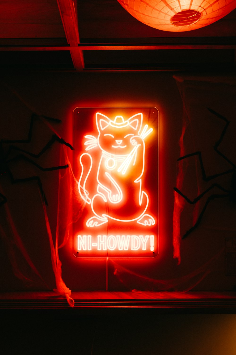 a neon sign with a cat on it