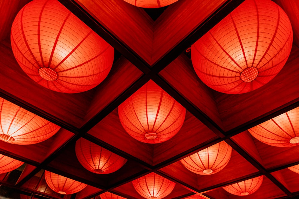 a group of red lanterns hanging from the ceiling