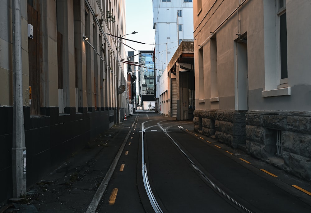 a narrow city street with buildings on both sides