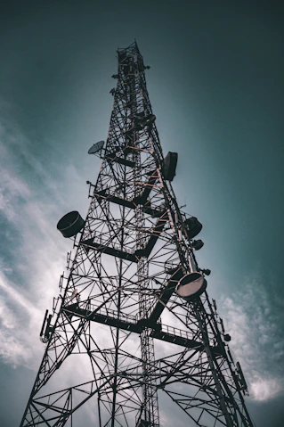 a very tall metal tower with lots of lights on it