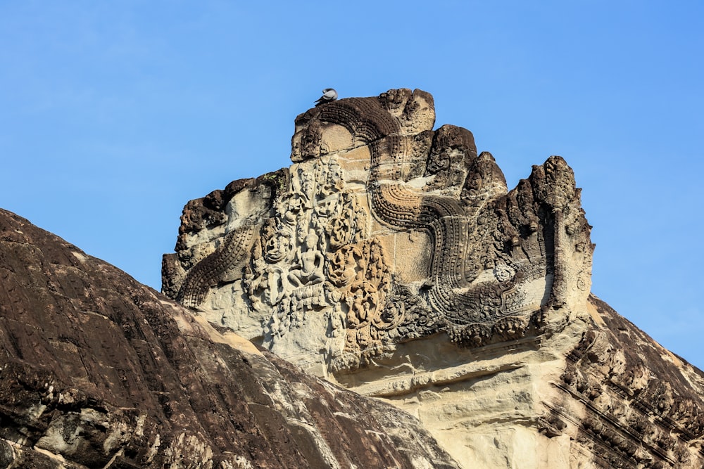 a large stone structure with carvings on the side of it