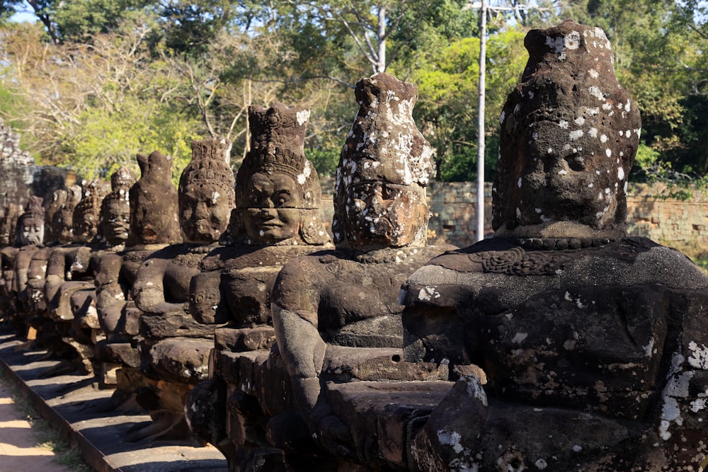 a row of statues sitting next to each other