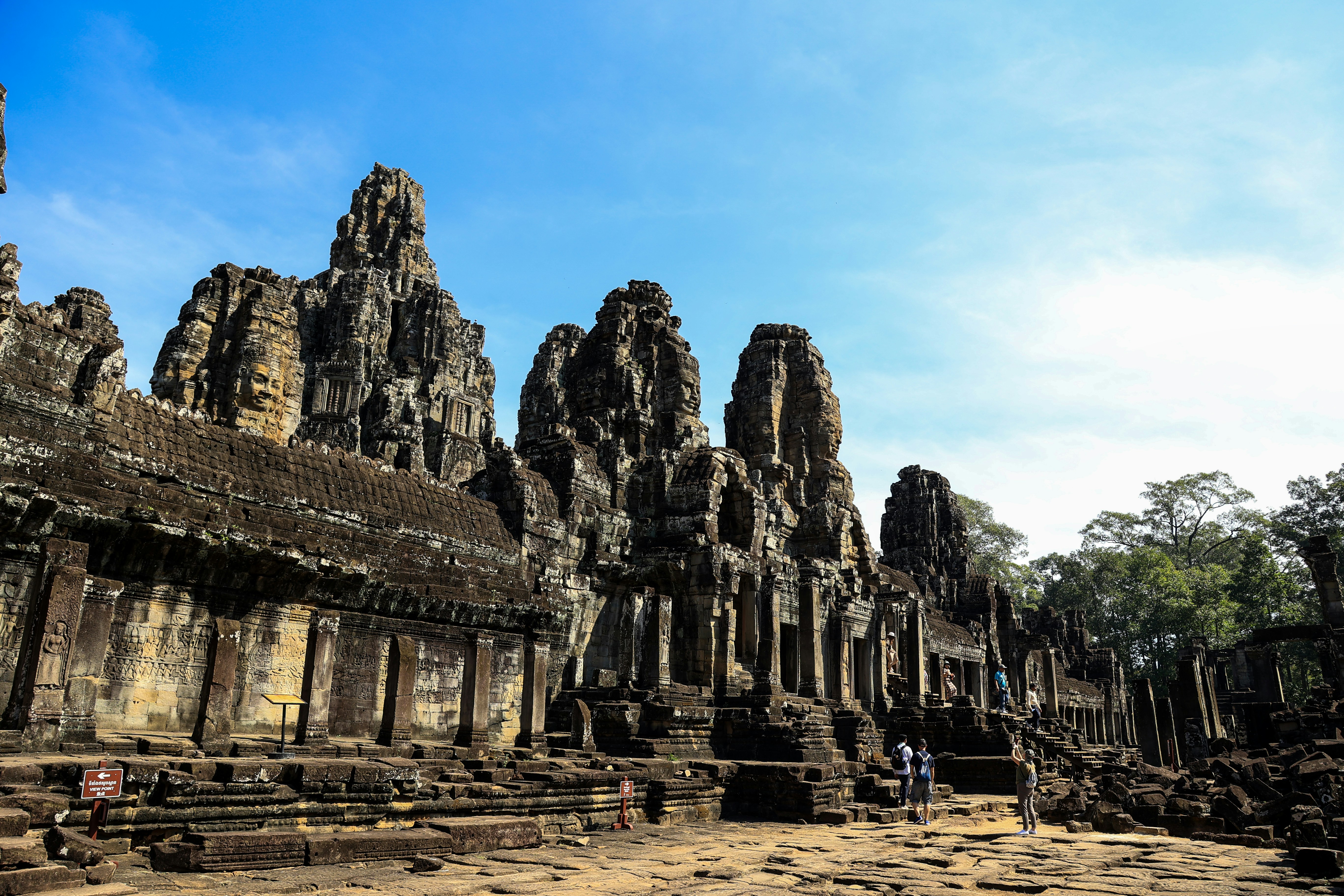 a group of people standing in front of a large building