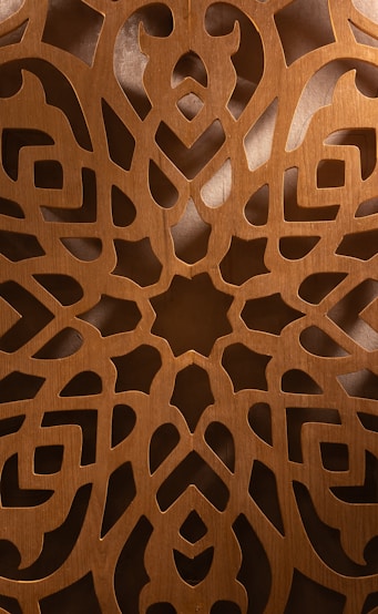 a close up of a wood carving pattern mandala