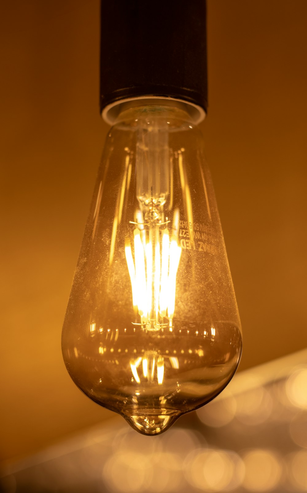 a light bulb hanging from a ceiling in a room