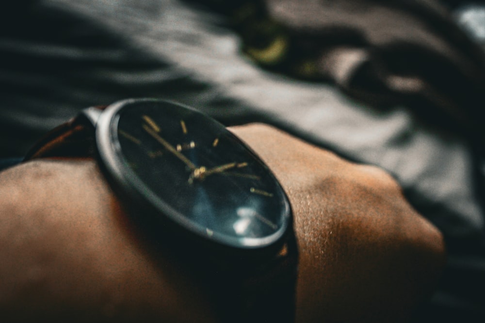 a close up of a watch on a person's wrist